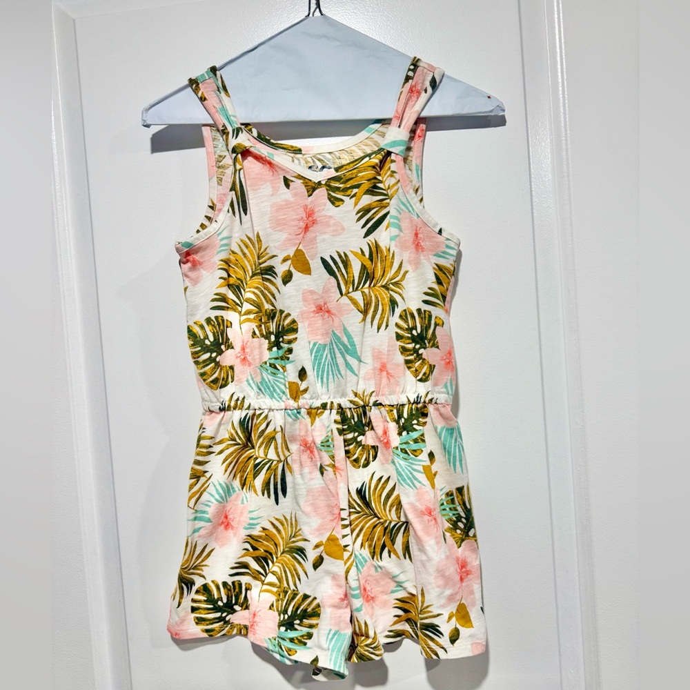 Girls Hawaiian flower cotton romper. Never worn.Ike new! Size L 10/12.